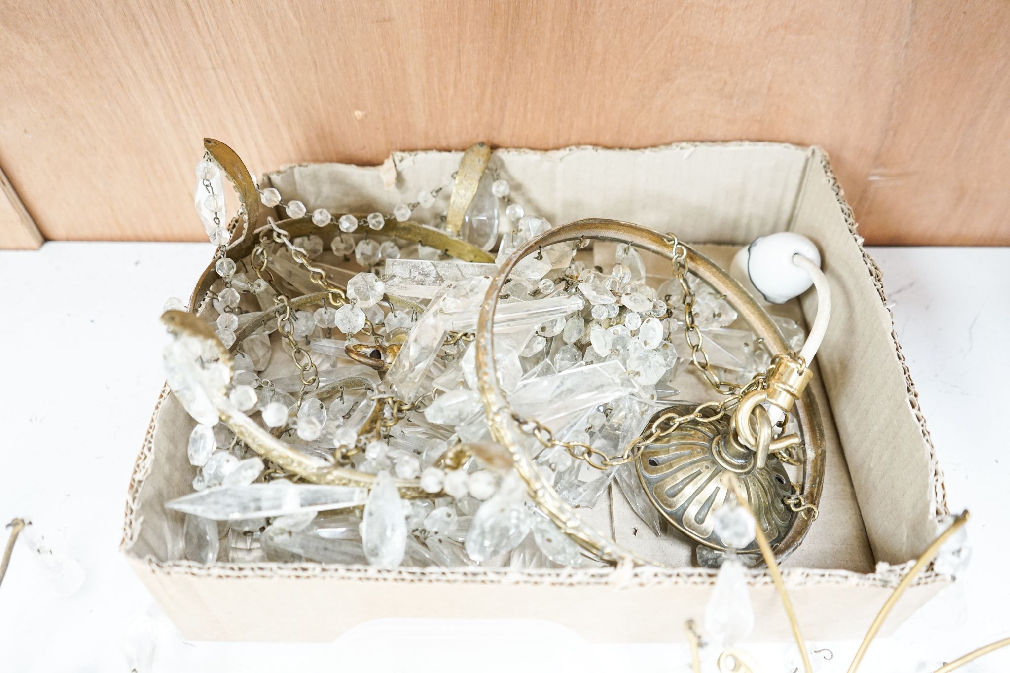 A pair of ormolu and cut glass twin branch wall lights, a bag light and a brass mount